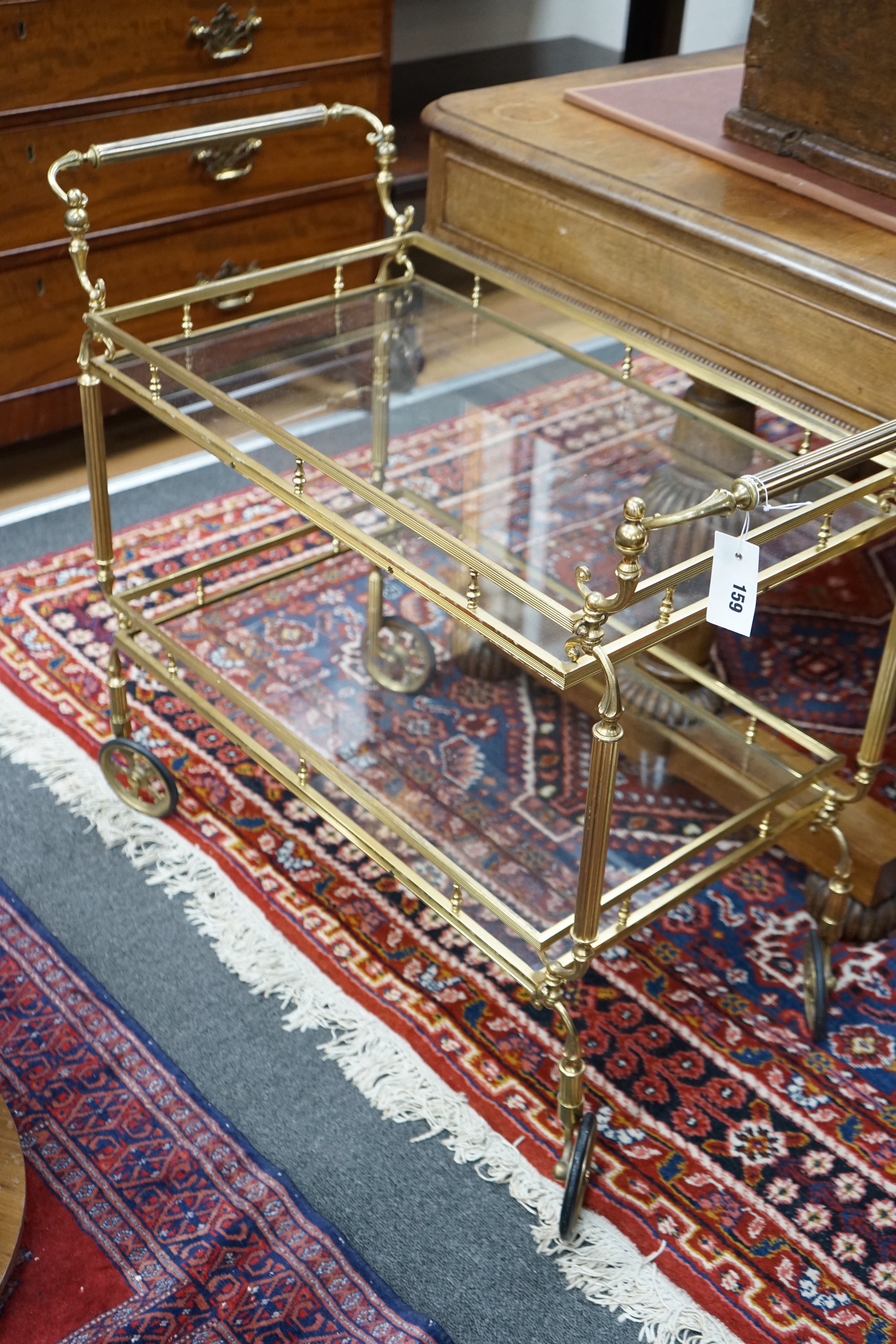 A brass and glass two tier tea trolley, width 84cm, depth 42cm, height 73cm